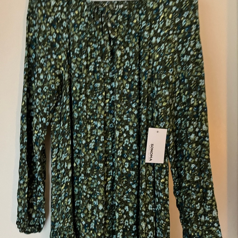 Lovely rayon dress with pleats with mid calf length. 100% rayon